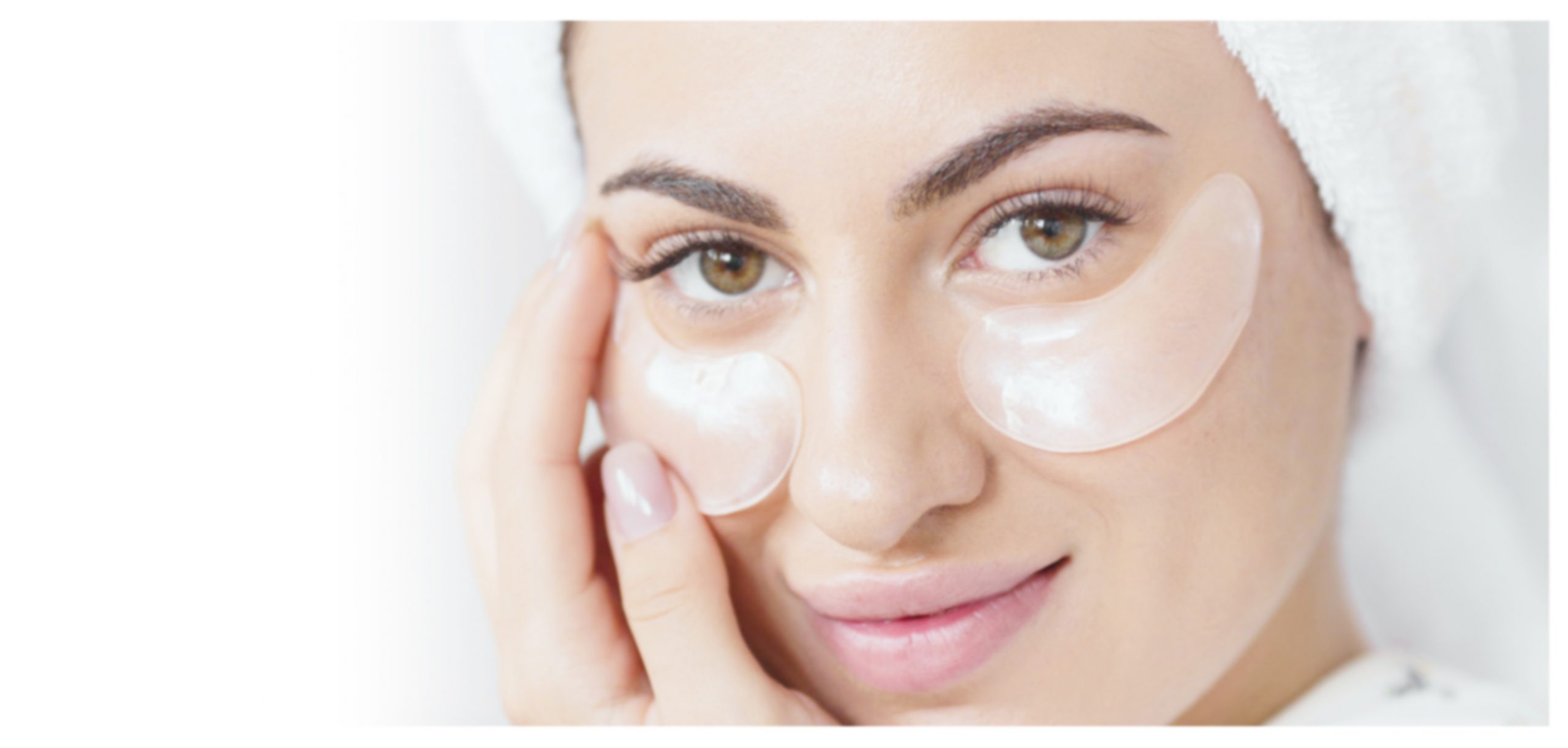 A lady applying soluble hydrogel eye patches